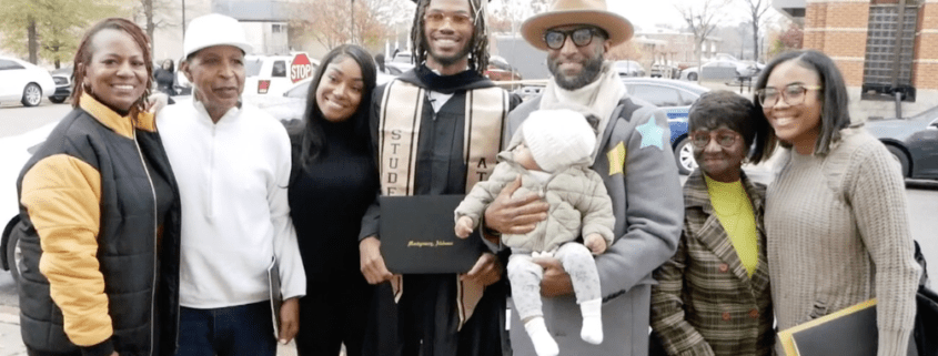 Family celebrating a graduation with baby present.